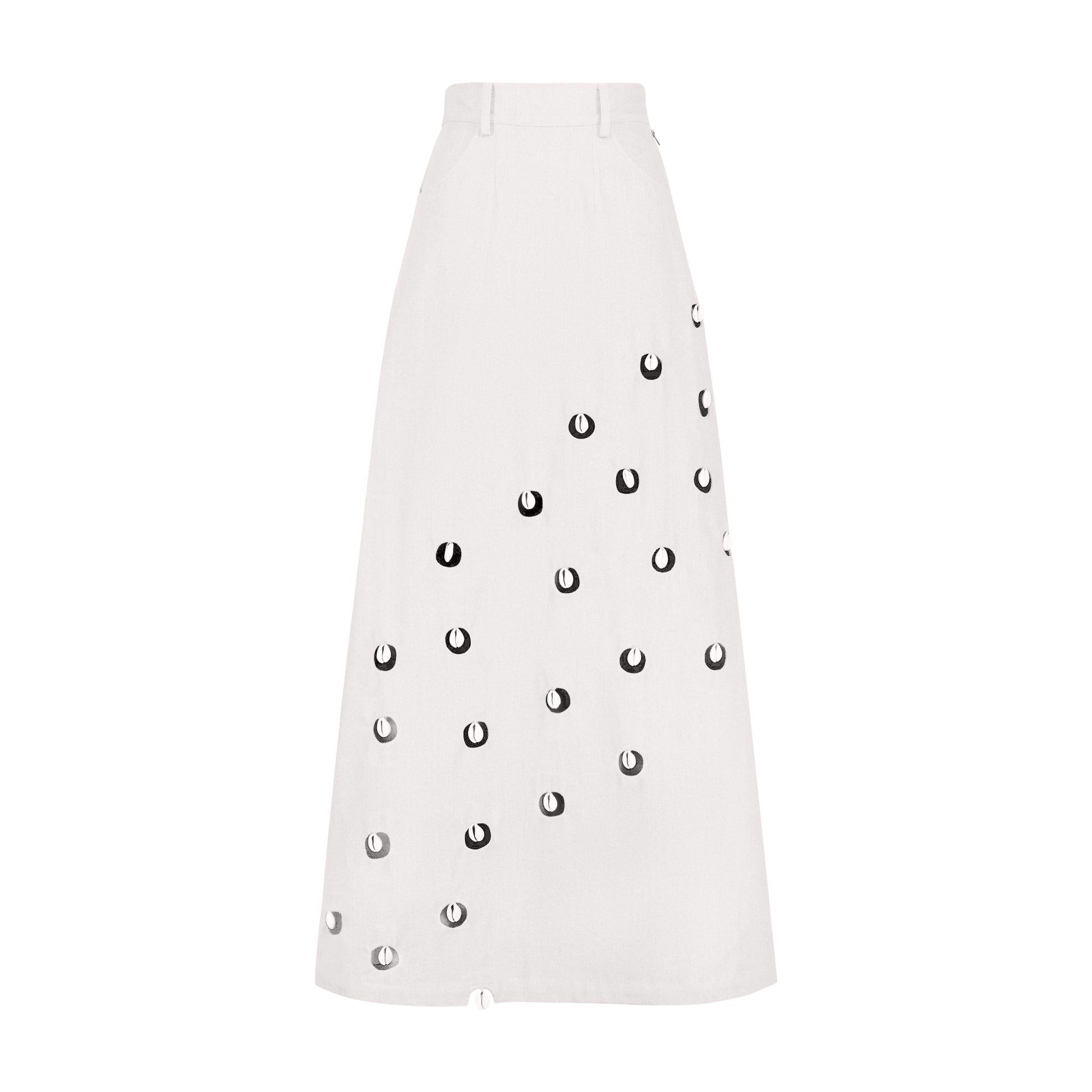 White cowrie detail denim maxi skirt featuring circular cut-outs and cowrie embellishments.