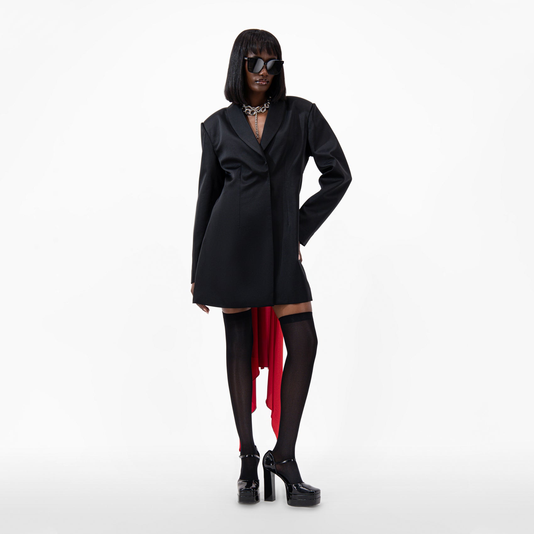 Oversize Silk Jacket in black with open back, floor-length scarf, and long sleeves styled with sunglasses and platform heels.