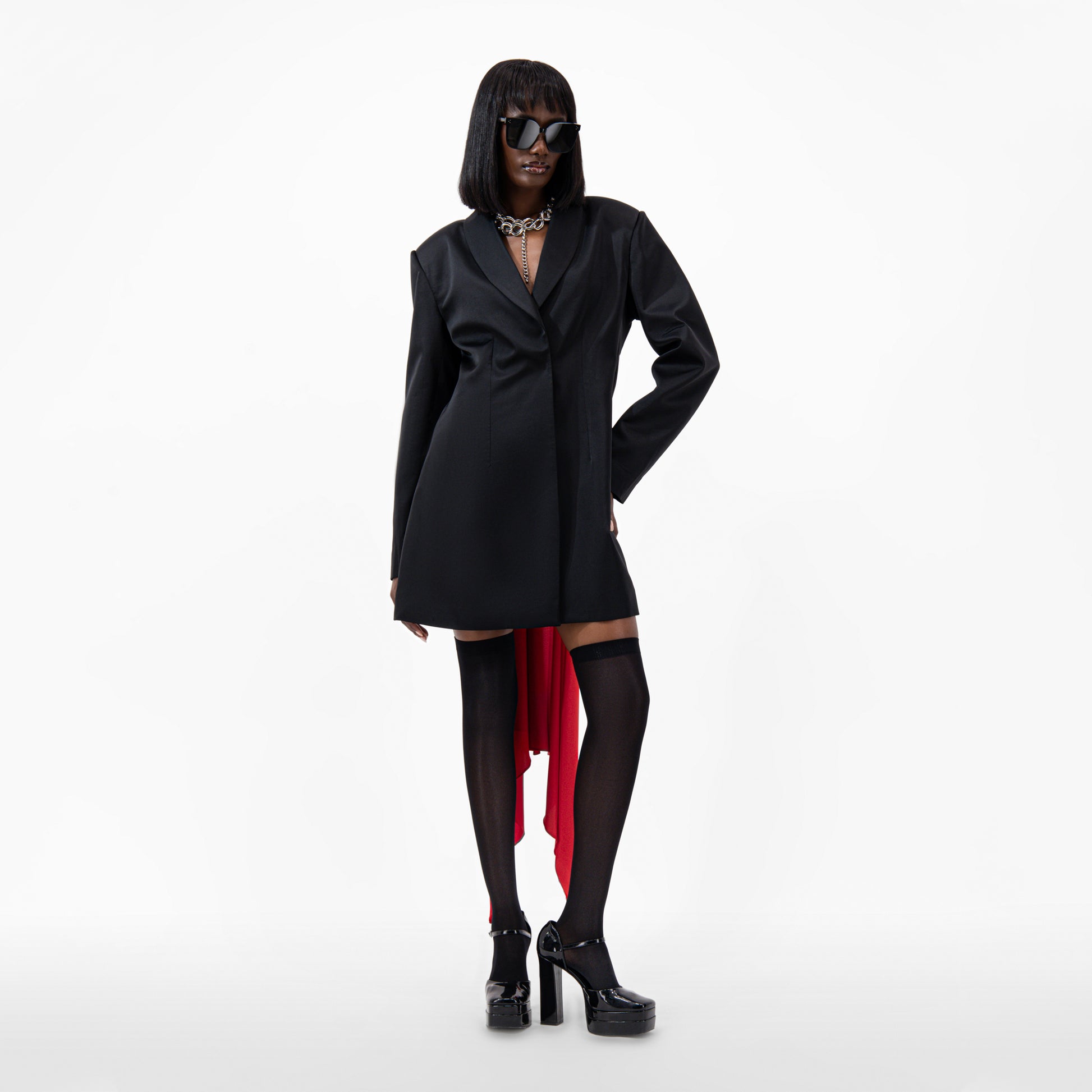 Oversize Silk Jacket in black with open back, floor-length scarf, and long sleeves styled with sunglasses and platform heels.
