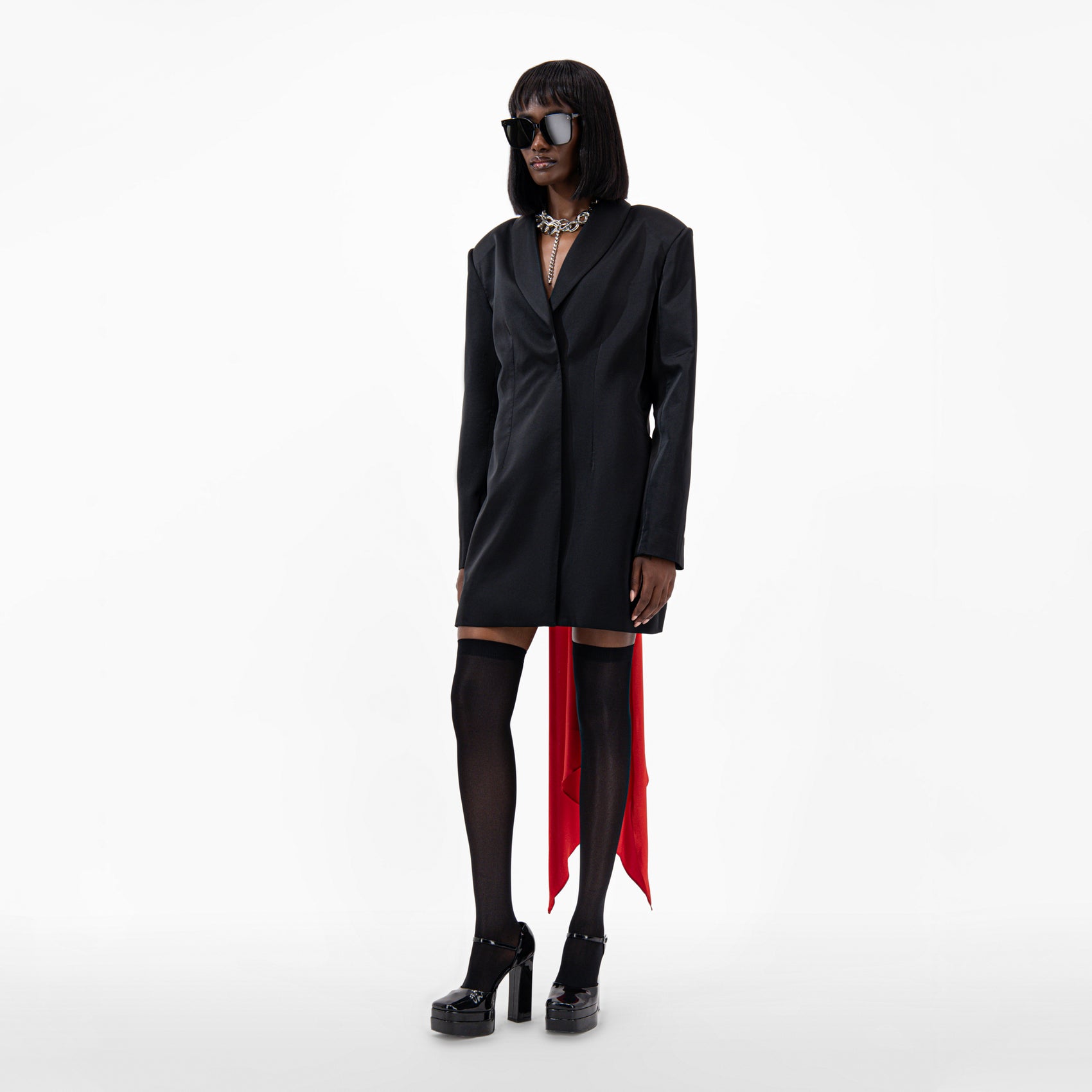 Oversize Silk Jacket worn with a detachable scarf, showcasing a chic open back design and stylish long sleeves.