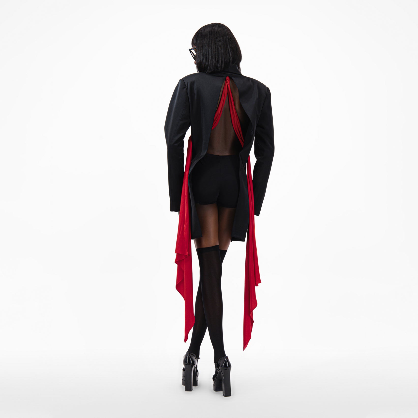 Oversize Silk Jacket with open back and detachable red scarf in a stylish black design.